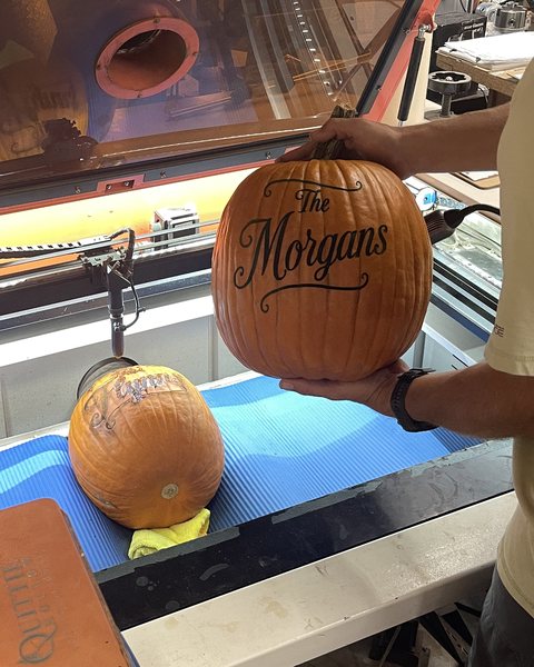 A pumpkin straight off the laser engraver, the design still pale