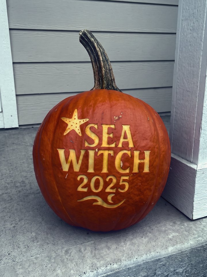 A pumpkin laser-engraved with Sea Witch 2025 and a starfish