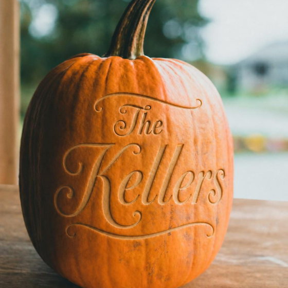 A pumpkin laser-engraved with the family name The Kellers in a flowing script