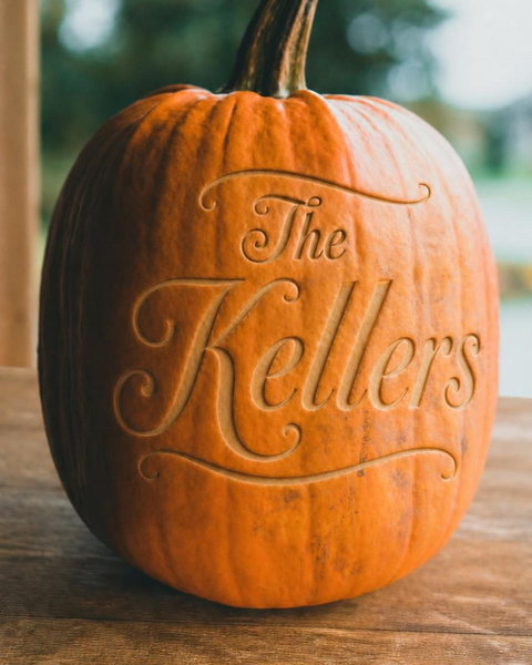 A pumpkin engraved in the flowing script style